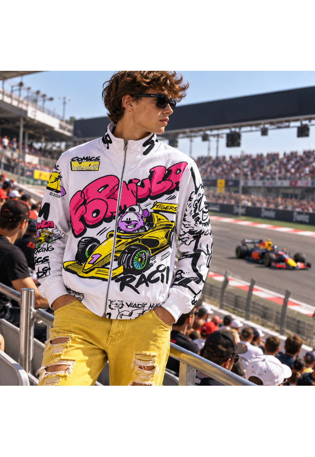 Model wearing Formula racing track jacket with bold graphics at a racing event, showcasing street art and sporty style.