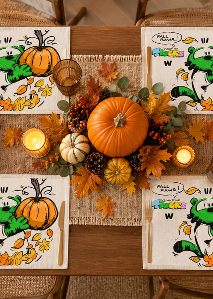 TIGERS FALL RAWR pumpkin placemat set featuring colorful artwork, autumn leaves, and a centerpiece on a dining table.