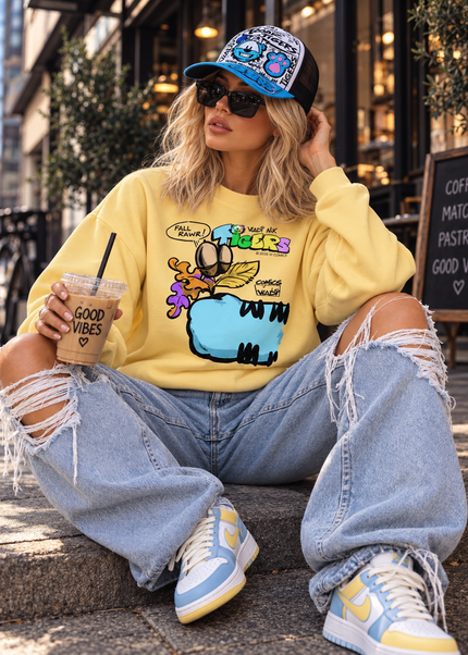 Woman wearing TIGERS™ Blue Tiger sweatshirt from the VI COMICS™ Fall Collection with a TIGERS cap and streetwear outfit