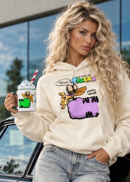Woman holding TIGERS™ Green Tiger Fall mug by VI COMICS™ while wearing a TIGERS™ Fall hoodie